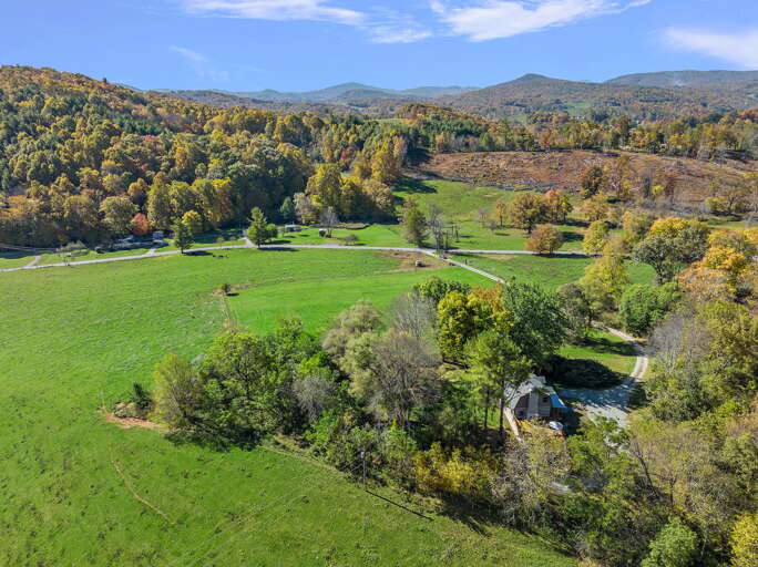 Big Hill Cabin Perched on Top of a Quiet Pastoral Knoll