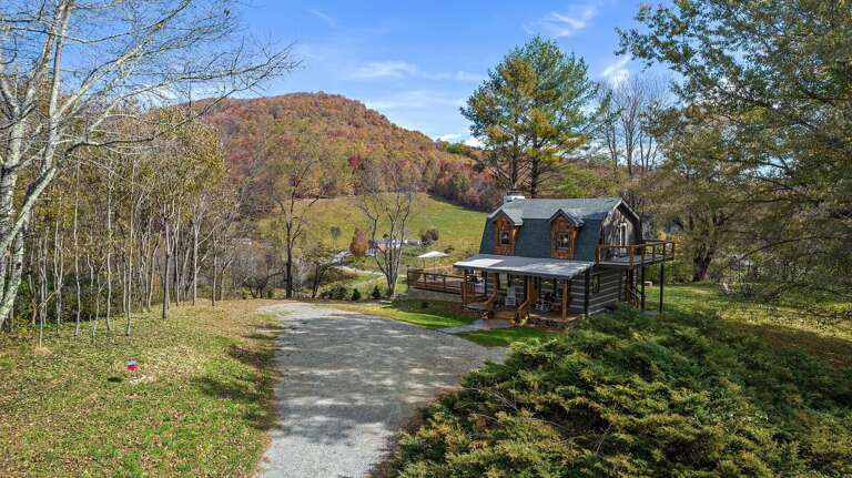 Cabin Tucked in the Trees on Top of the Knoll