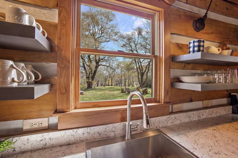 View of the Expansive Yard and Fire Pit Area from the kitchen