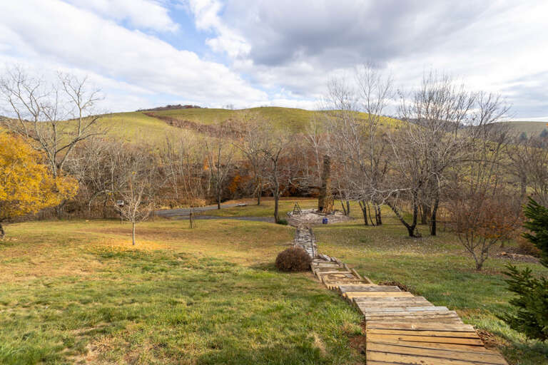 Stretching Stone and Wood Path to the Chimney Fire Pit