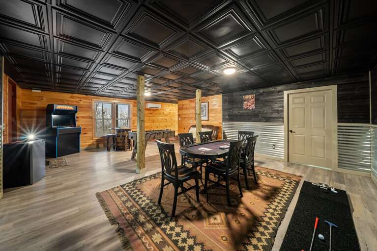 Lower Level Game Room with Card Table, Foosball, and Arcade