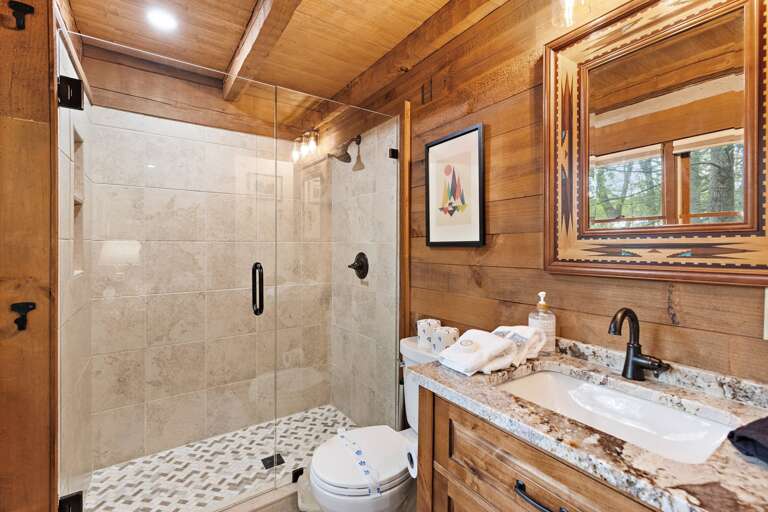 Ensuite Bathroom in the Main Floor Bedroom with Tile Step In Shower
