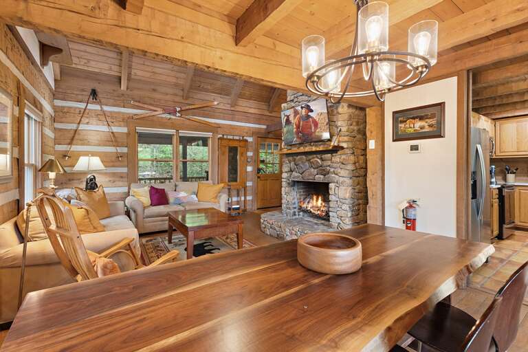 Wood Burning Stone Fireplace and Mounted TV in the Living Room Wood Burning Stone Fireplace and Mounted TV in the Living Room