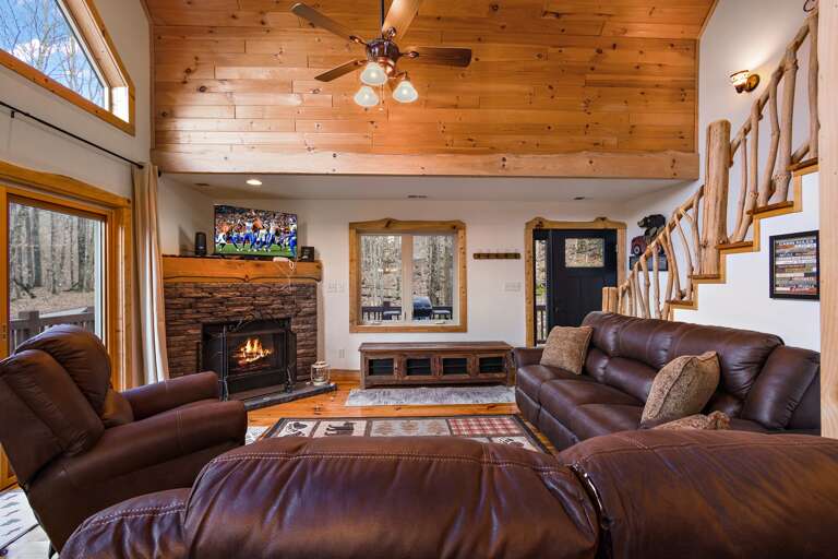 Stacked Stone Gas Log Fire Place and Flat Screen TV in the Living Room