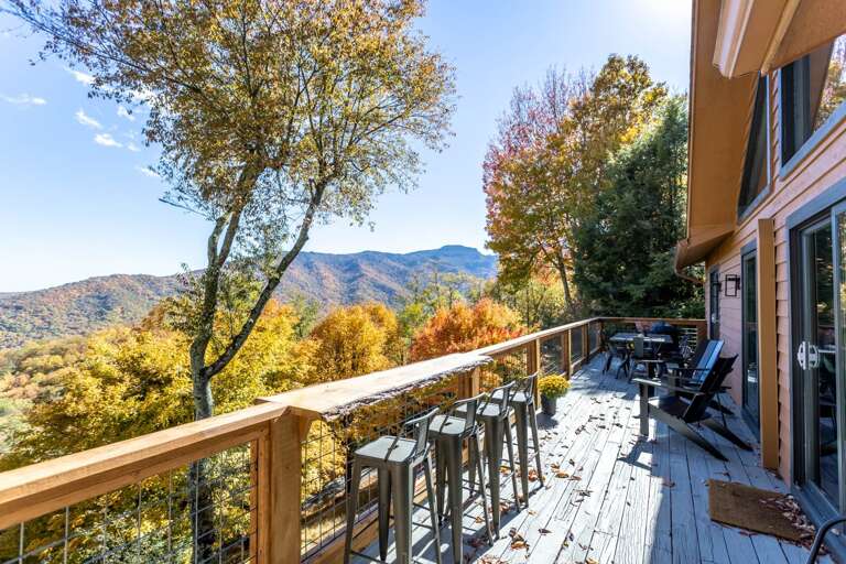 Main Level Deck with Raw Edge Wood Bar, Seating and Views
