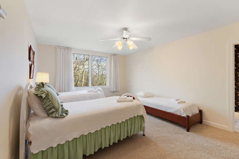 Two Twin Beds and an Additional Child Bed in the Twin Bedroom