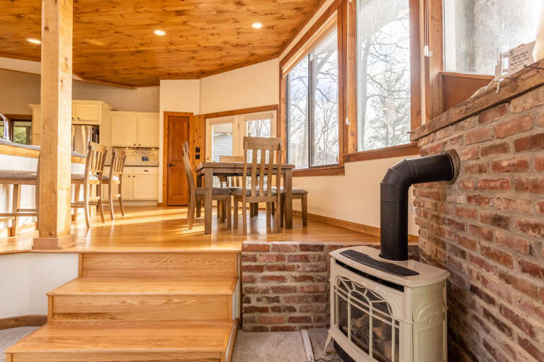 Gas Stove in the Living Room with Dining and Kitchen Above