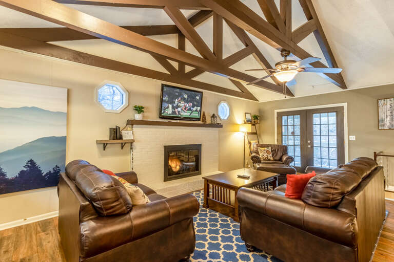 Leather Furniture, Mounted TV, and Gas Log Fireplace in the Living Room Leather Furniture, Mounted TV, and Gas Log Fireplace in the Living Room