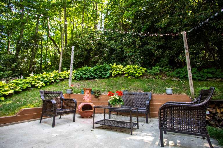 Patio with Seating, String Lights and Chiminea Patio with Seating, String Lights and Chiminea