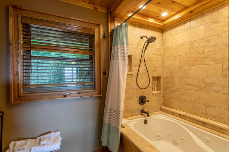 Jetted Soaking Tub and Shower in the Ensuite Bathroom