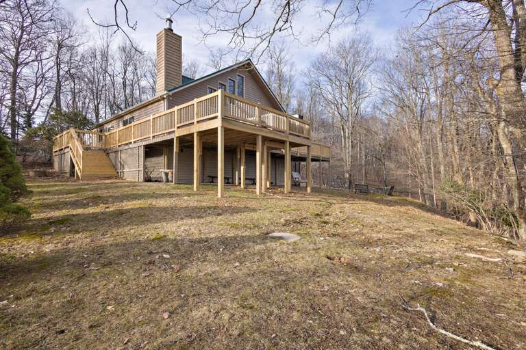 Spacious Backyard with a Fire Pit Spacious Backyard with a Fire Pit