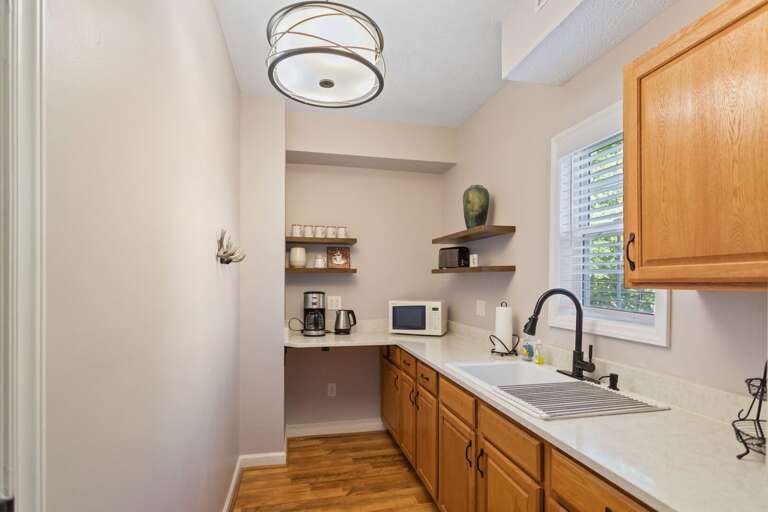 Lower Level Kitchenette with Full Fridge, Sink, Coffee Maker and Microwave