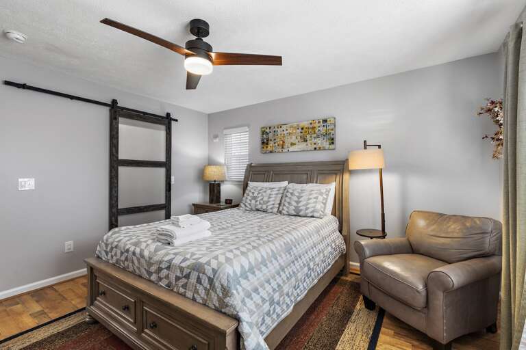 Queen Bed and Chair in the Master Bedroom