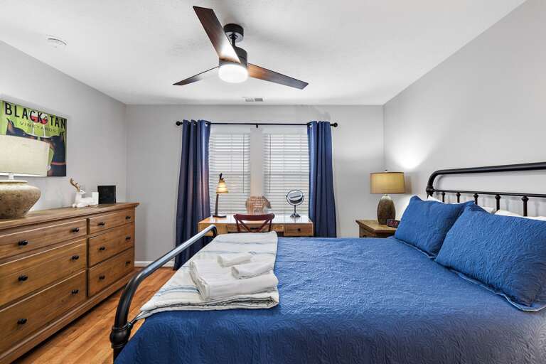 Queen Bed and Writing Desk in the Lower Level Bedroom