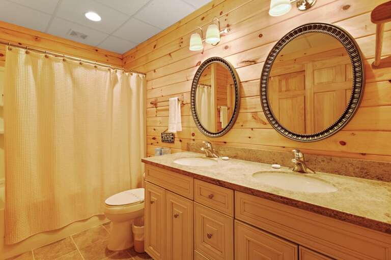 Lower Level Ensuite Bathroom with Tub and Shower Combo