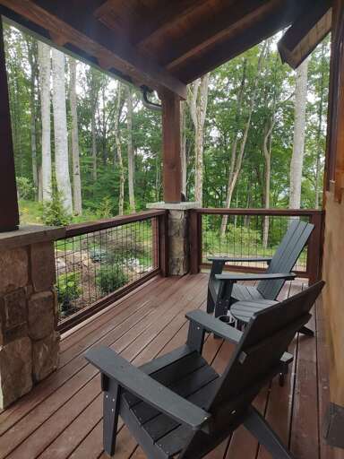 Wooden Balcony With Chairs Overlooking Forest Wooden Balcony With Chairs Overlooking Forest