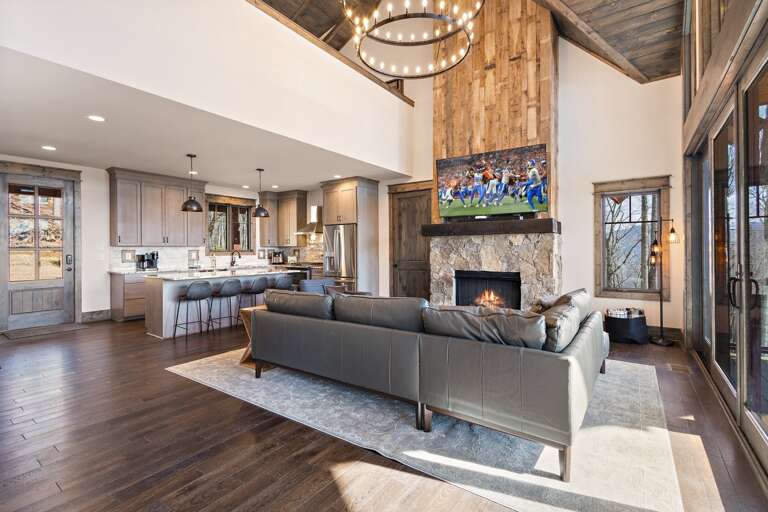 Open Main Floor Living Space with Gas Log Fireplace and TV Open Main Floor Living Space with Gas Log Fireplace and TV