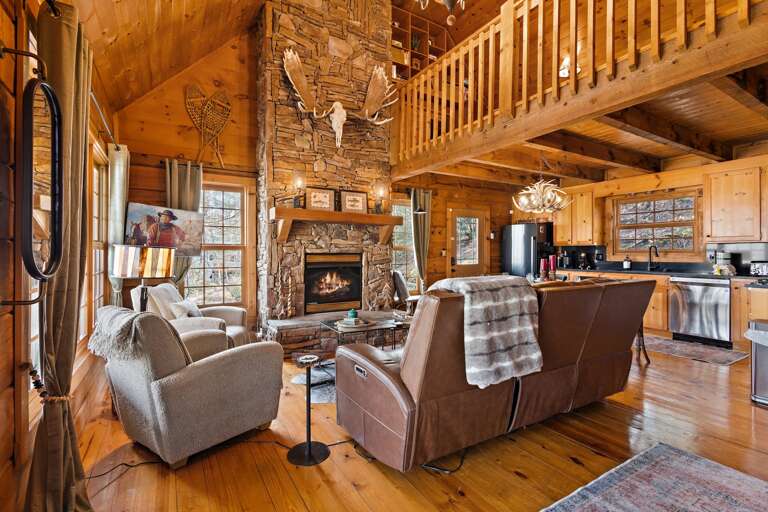 Reclining Leather Sofa, Comfy Chairs and TV in the Living Room with Loft Above