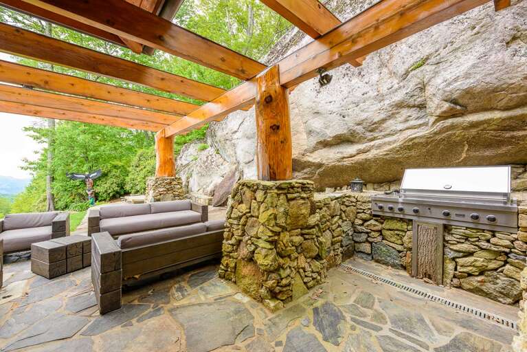Comfortable Seating on Stone Patio with a Built-In Gas Grill