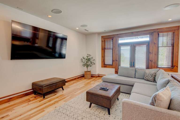 Family Room with Big Screen TV, Comfortable Furniture and Back Yard Access