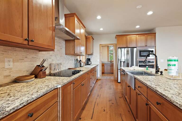 Spacious Kitchen with Granite Counter Tops and Stainless Appliances