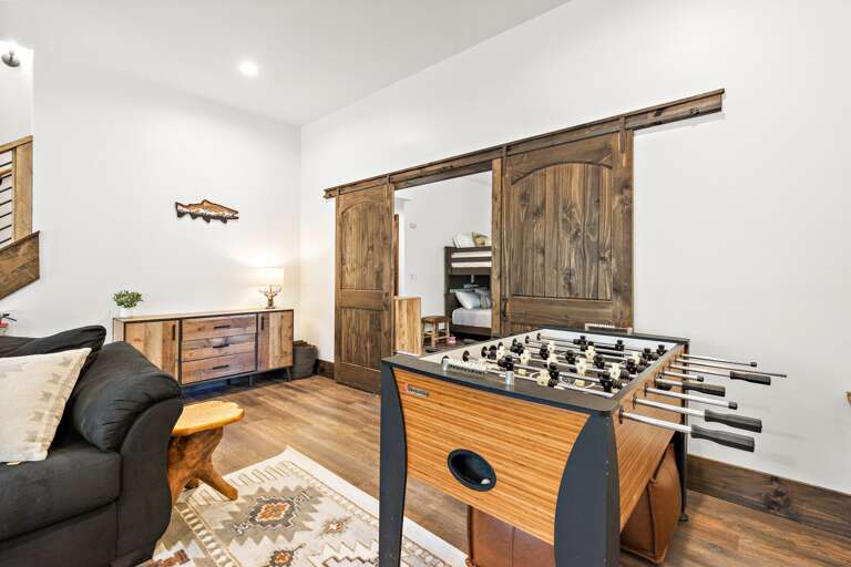 Enjoy a Game of Foosball in the Lower Level Living Area