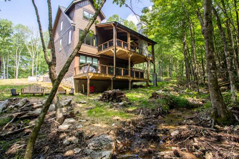 Shaded Back Yard with Seating and a Flowing Creek