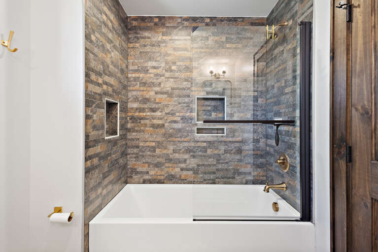 Upstairs Ensuite Bathroom with Huge Tub and Tiled Shower