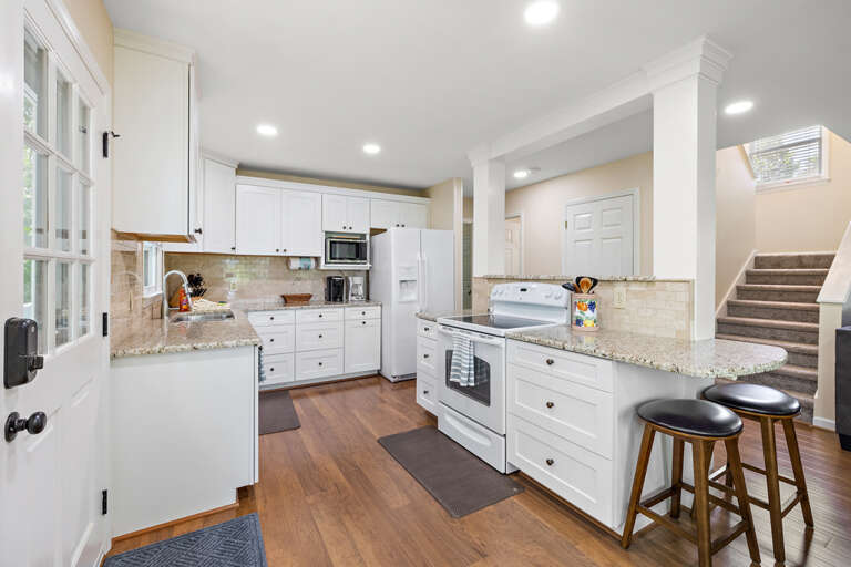 Bright Open Kitchen with Granite Countertops