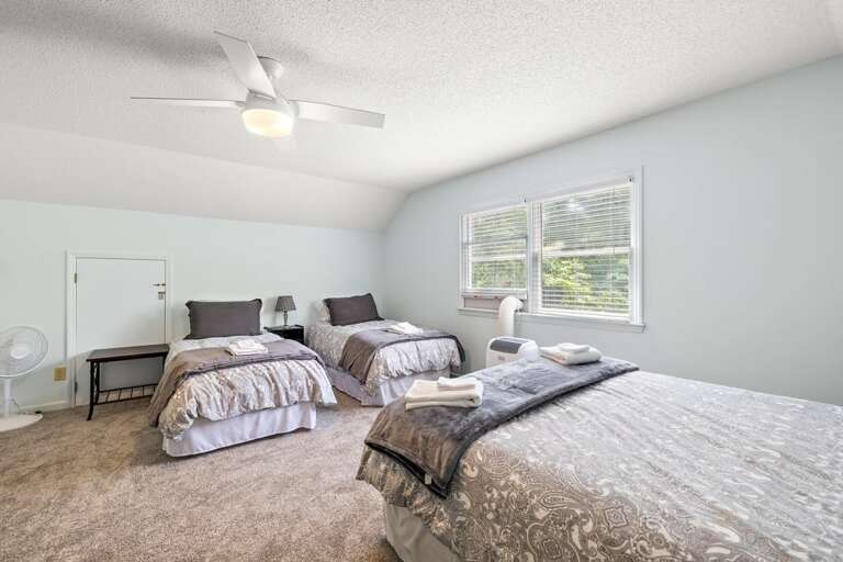 Upper-Level Sleeping Area with a Queen and Two Twin Beds