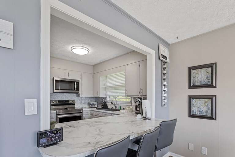 Serve Through Window from the Kitchen to the Dining Area Serve Through Window from the Kitchen to the Dining Area