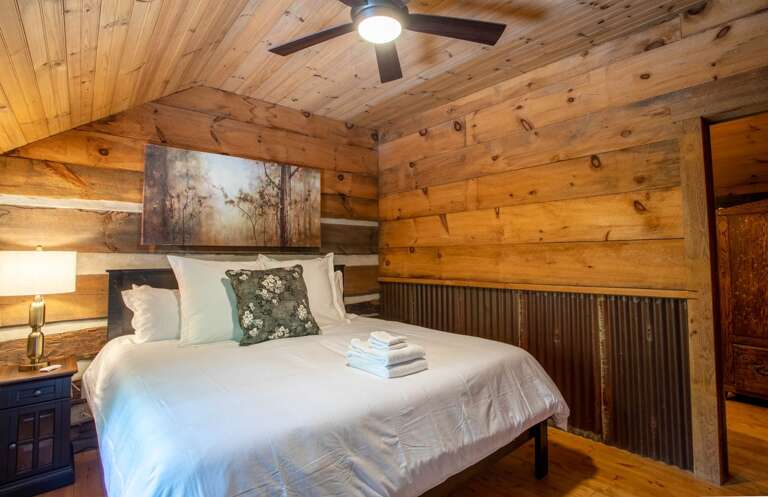 Second Floor Bedroom with Exposed Log and Metal Walls