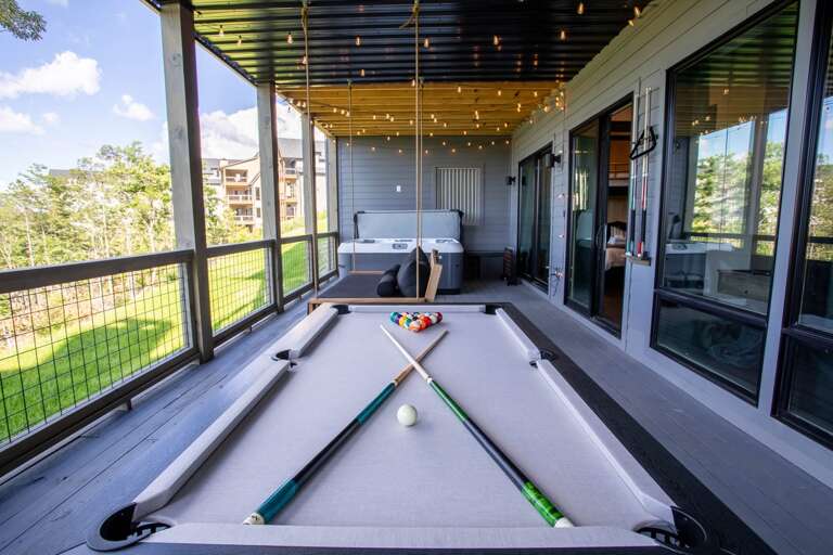 Large Lower Deck with Hot Tub, Swinging Bench, and Pool Table Large Lower Deck with Hot Tub, Swinging Bench, and Pool Table