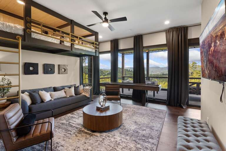 Lower Level Bonus Room with Suspended Bunk Beds, Shuffleboard, and Hot Tub Deck Lower Level Bonus Room with Suspended Bunk Beds, Shuffleboard, and Hot Tub Deck