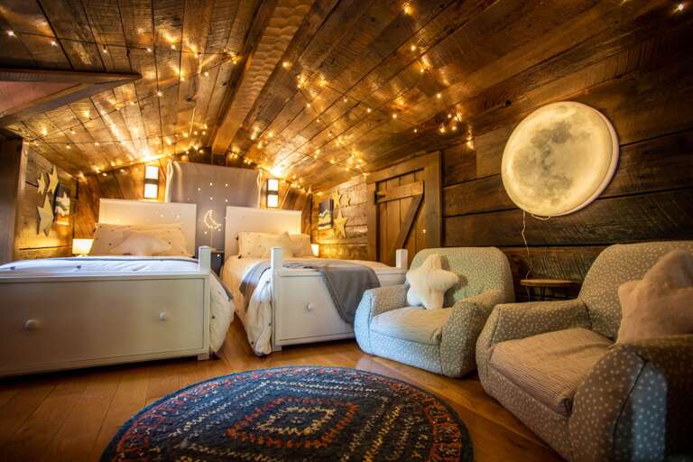 Cushion Chairs in Loft Bedroom, which Overlooks the Main Level Living Room