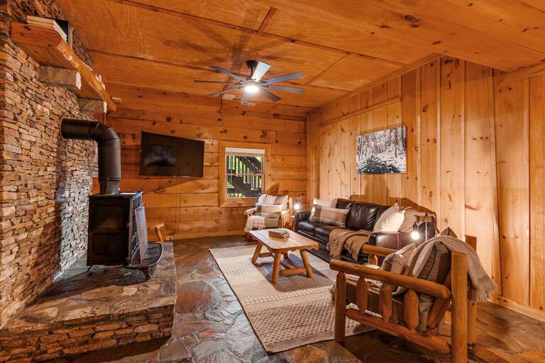 Leather Sofa and Mounted TV in the Den (wood stove is not operational)