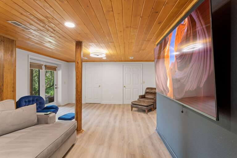 Media Area in the Lower Level with Couch that is Designed for Sleeping for Two