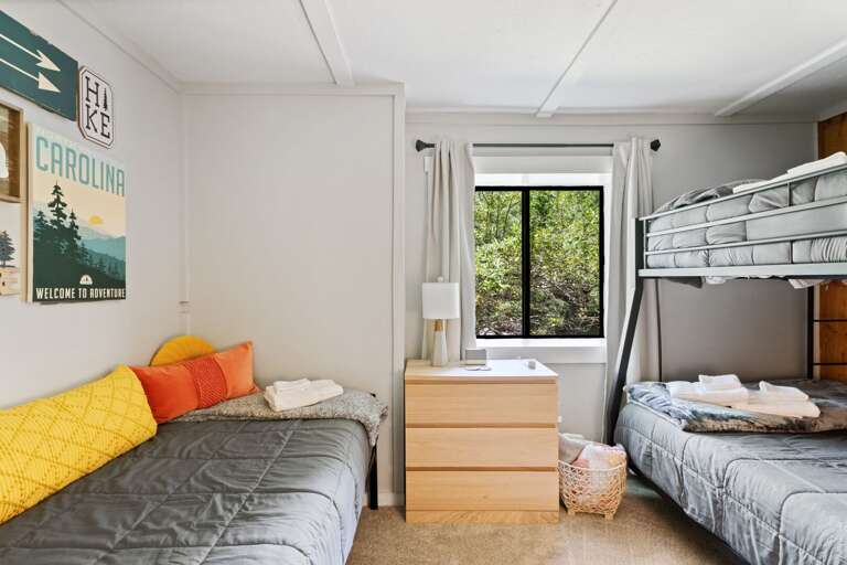 Bunk Room on the Lower Level with a Double Over Queen Bunk Bed and Side Twin Bed