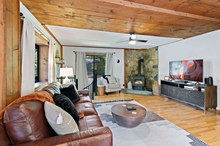 Lower Level Living Room with TV (WOOD STOVE IS NOT OPERATIONAL)