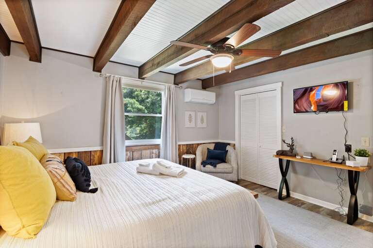 TV in the Master Bedroom with a King Bed