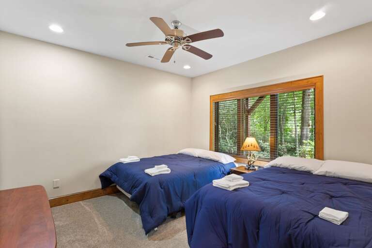 Lower Level Bedroom with Sleeping for Four in Two Queen Beds