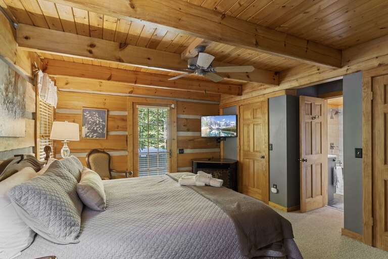 Main Floor Master Bedroom with TV, Ensuite Bathroom and Deck Access