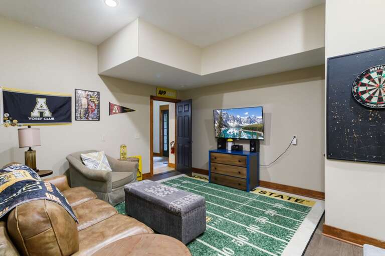 Entertainment Room on the Lower Level with TV and Darts