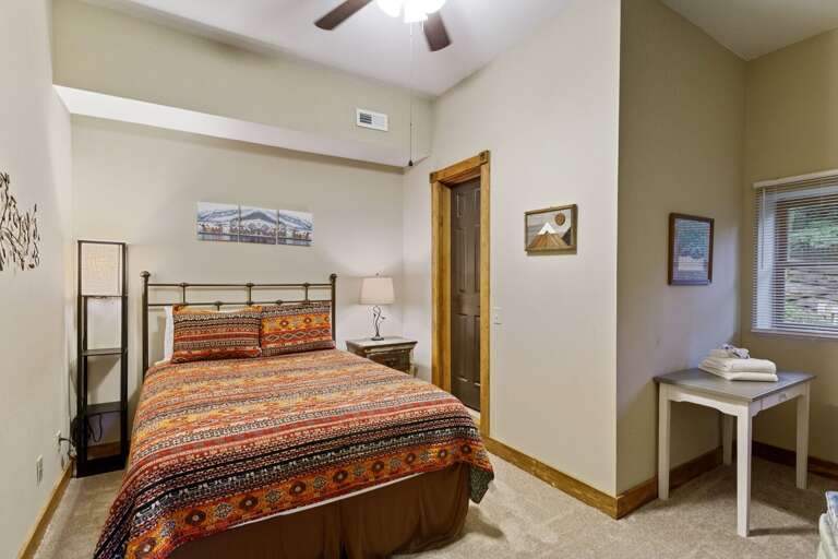 Lower Level Bedroom with Queen Bed and TV