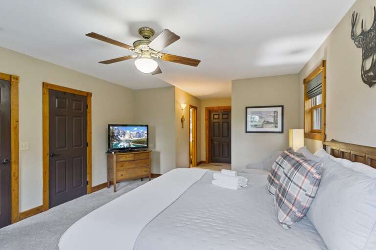 Main Floor Master Bedroom with TV and Ensuite Bathroom