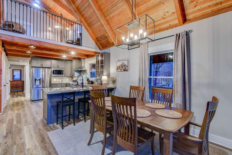 Dining Area and Kitchen with Additional Bar Seating Dining Area and Kitchen with Additional Bar Seating