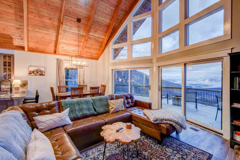 Leather Sectional Sofa in the Living Room Framed by Mountains Leather Sectional Sofa in the Living Room Framed by Mountains