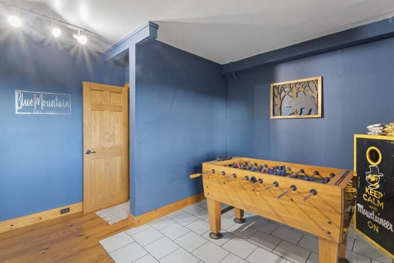 Lower Level Game Room with Foosball Table and Corn Hole Boards