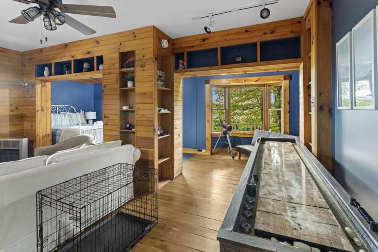 Shuffleboard Table on the Lower Level and Reading Nook with a Telescope