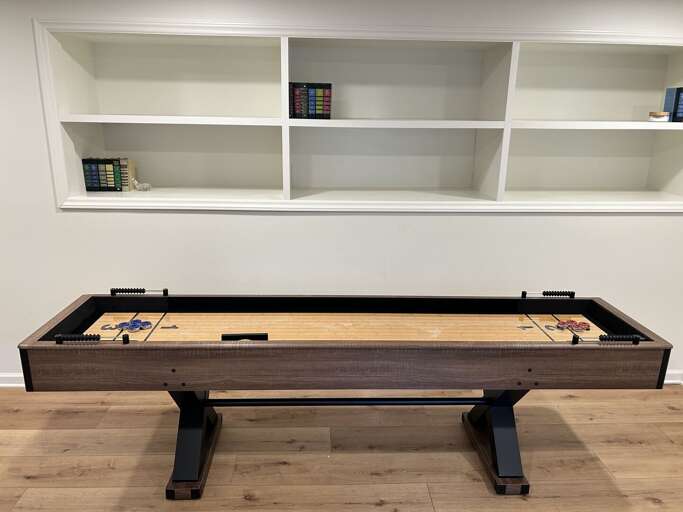Shuffleboard Table in the Lower Level Den Shuffleboard Table in the Lower Level Den